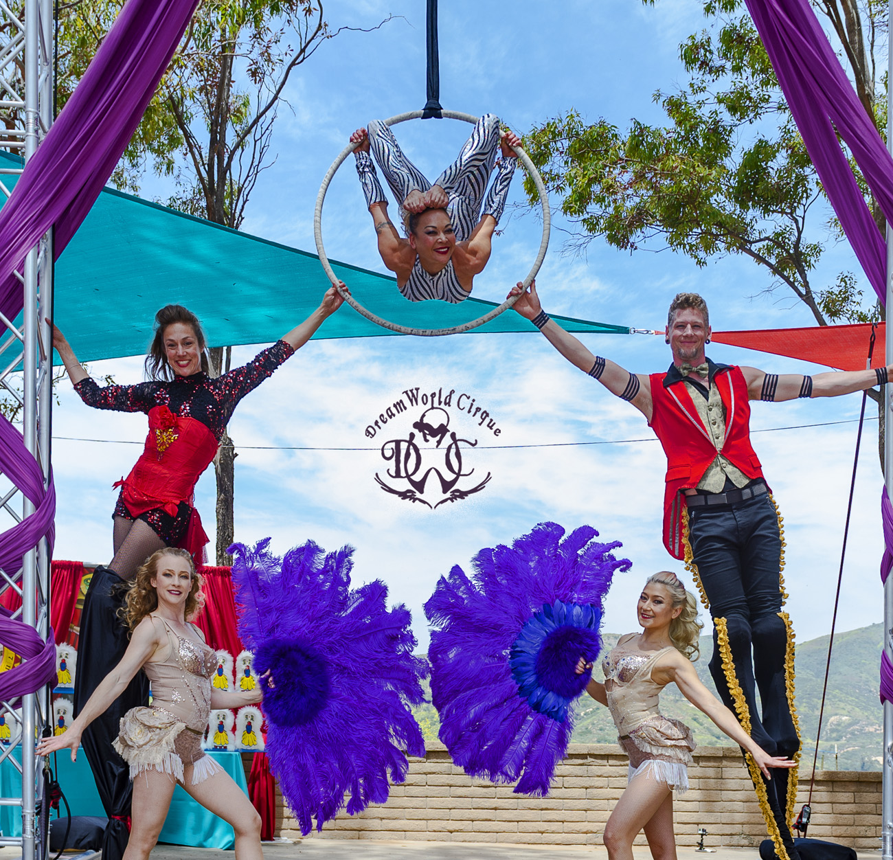 Group of Circus Performers Pose By The Rig at Greatest Showman Event