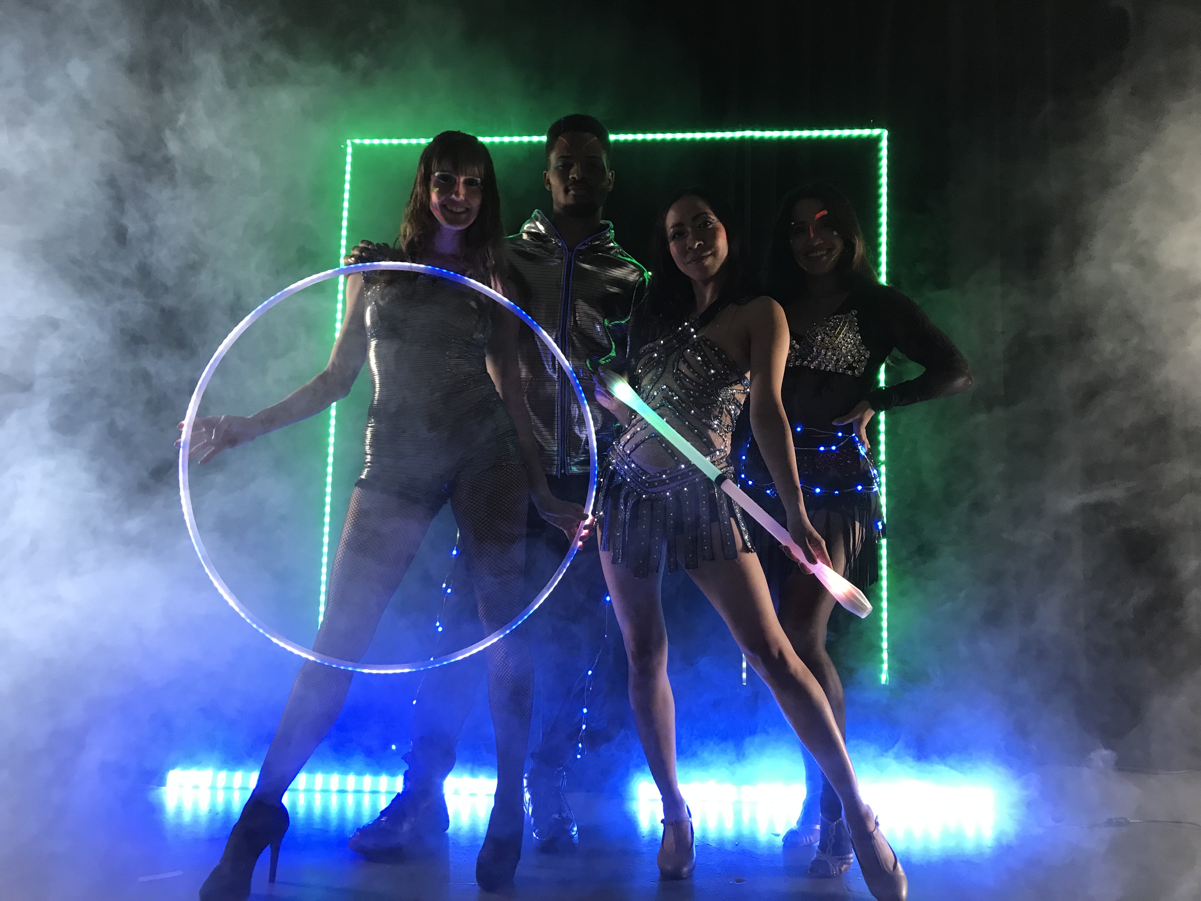 Group of performers in LED costumes at a themed event
